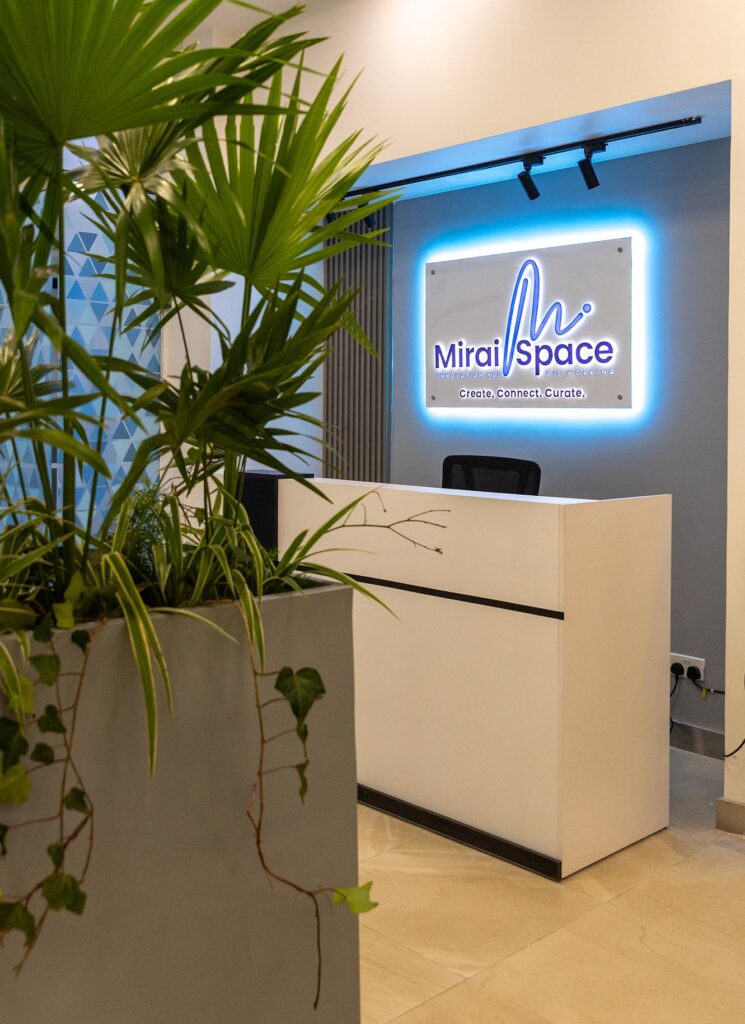 Miraispace reception showing logo and live plant